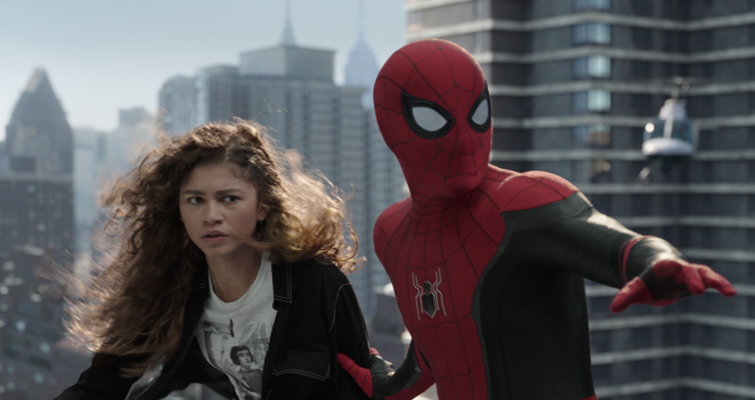 A scene from Spider-Man: No Way Home with M.J. and Spider-Man in a tenuous situation on top of a high-rise